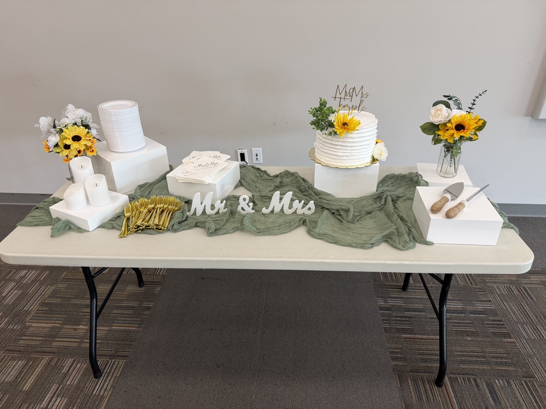 Wedding cake table with greenery runner